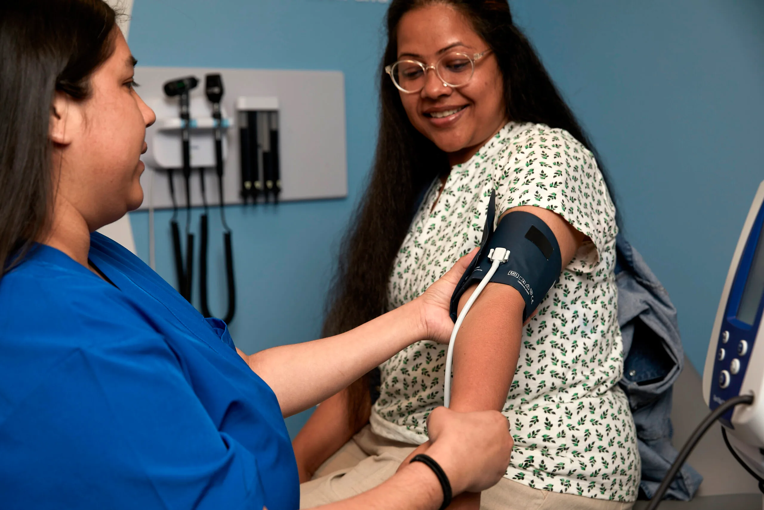 Woman getting her blood pressure checked.