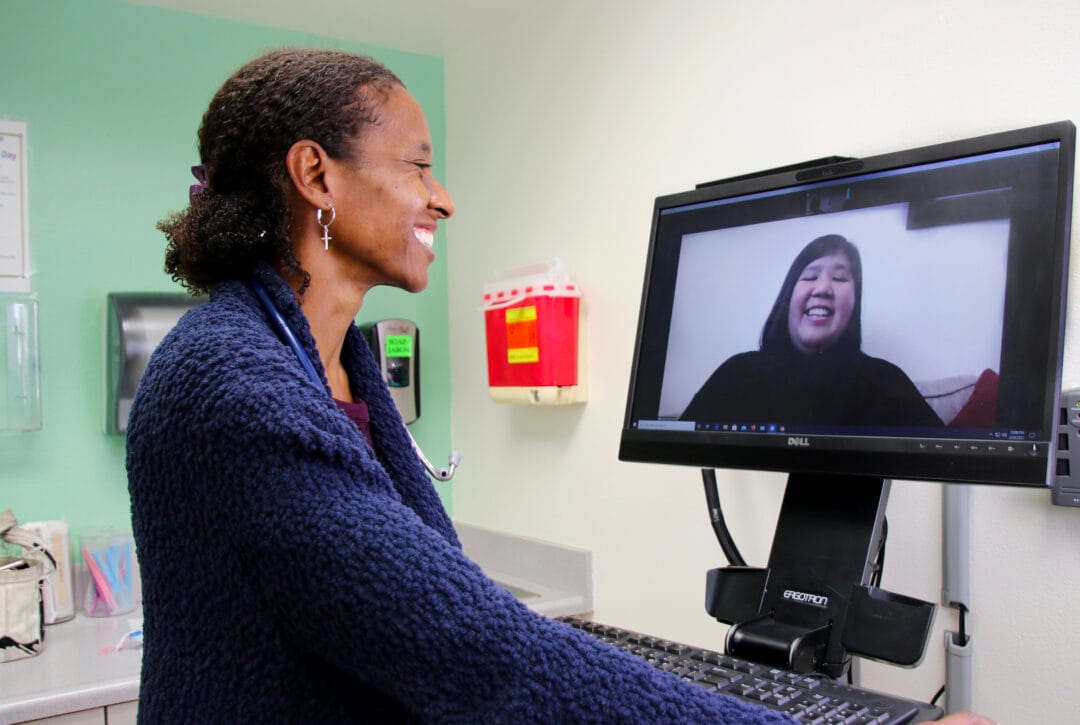 Two women participating in a telehealth call.