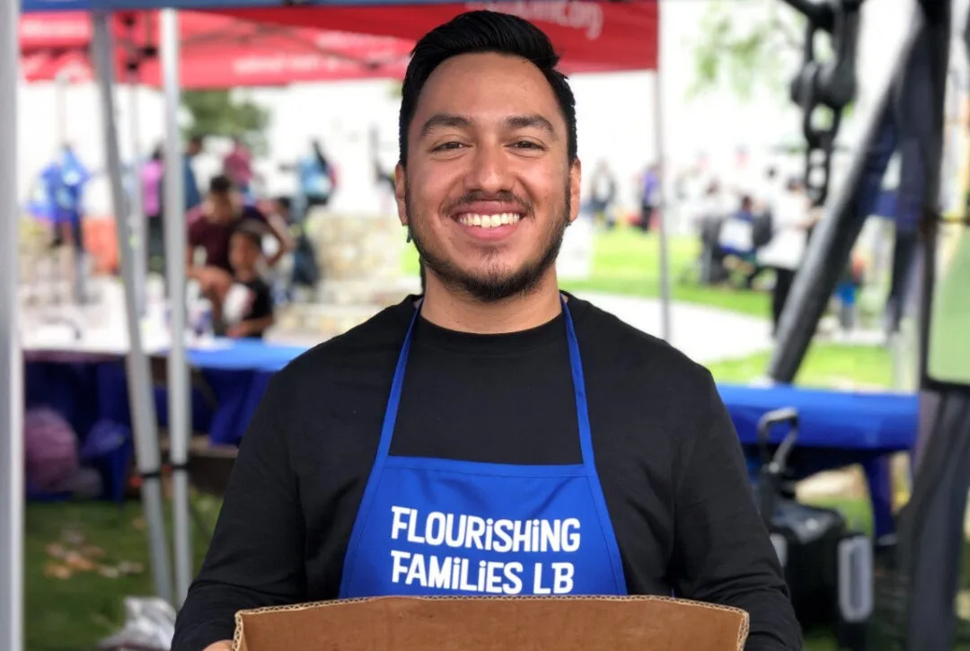 Man handling food for the Flourishing Families Program.